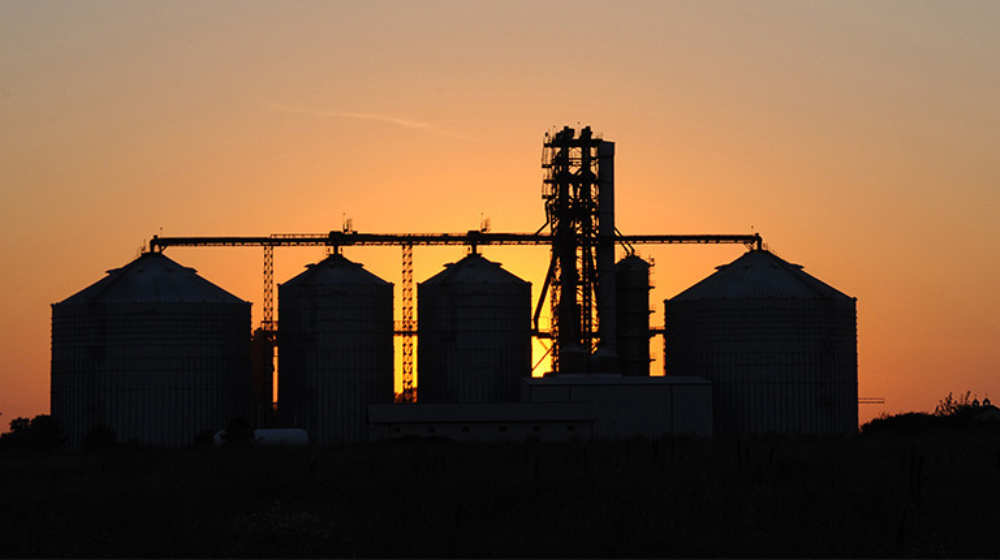 Grain bins at dusk