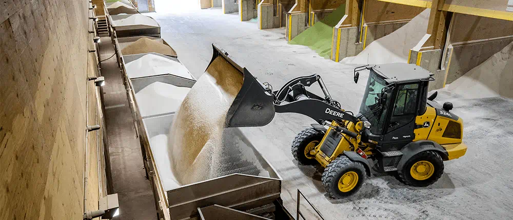 A bulldozer loading urea in a warehouse in Galveston, Tx.