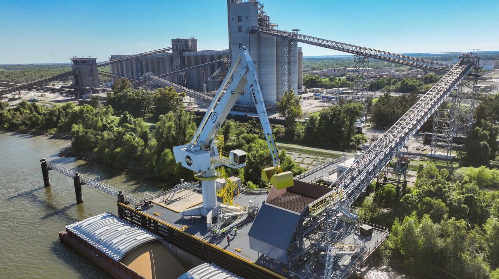 A crane unloading a barge.