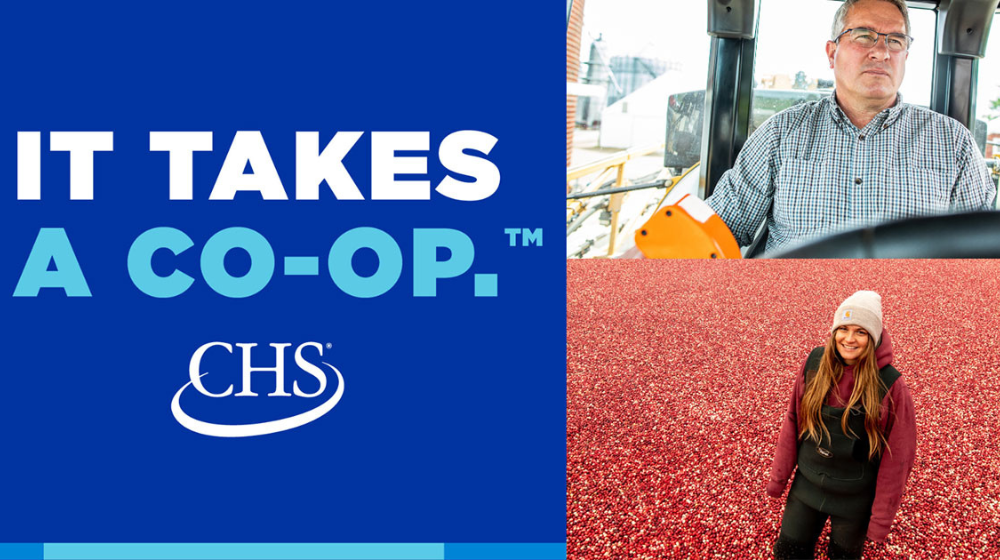 It takes a co-op logo with a man in a tractor and a woman in a cranberry field