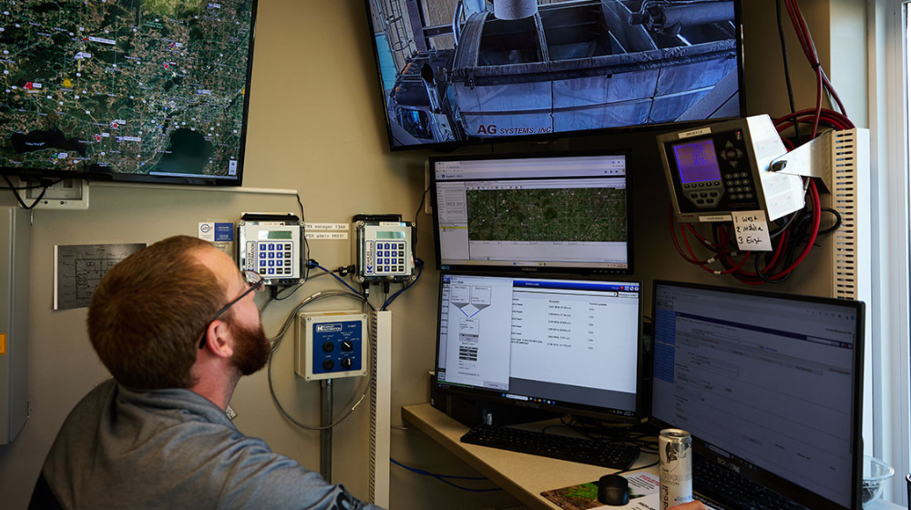 Man sitting at a control panel