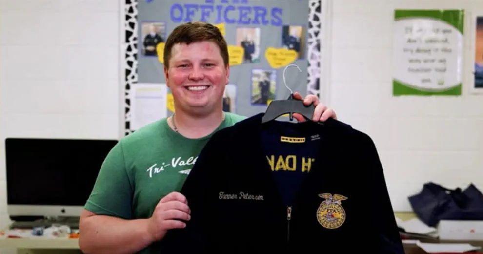 Man holding up FFA jacket
