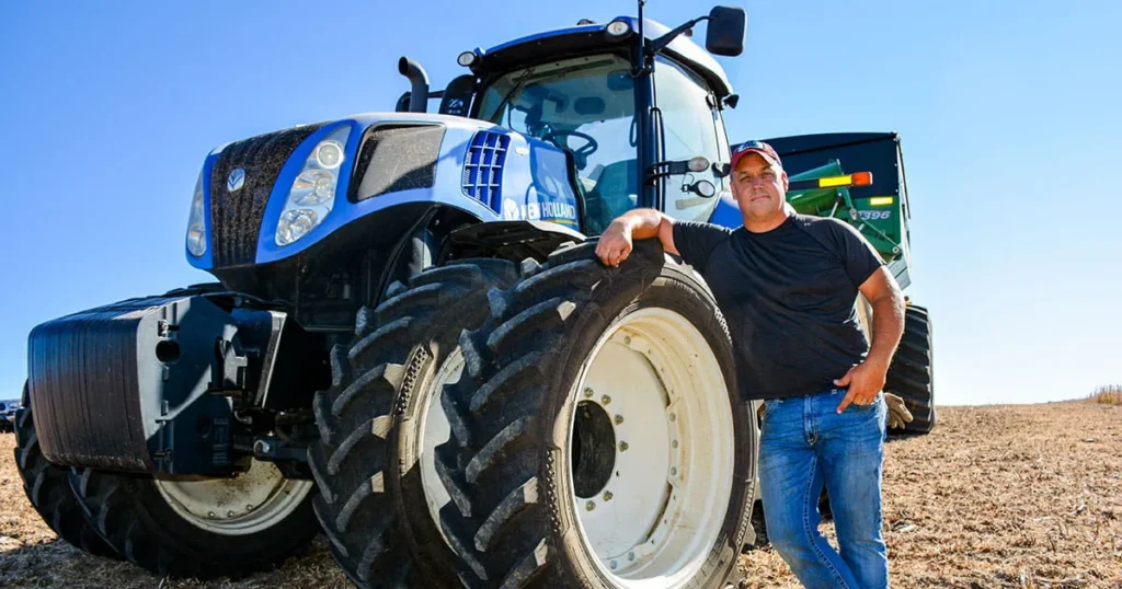 man standing by tractor