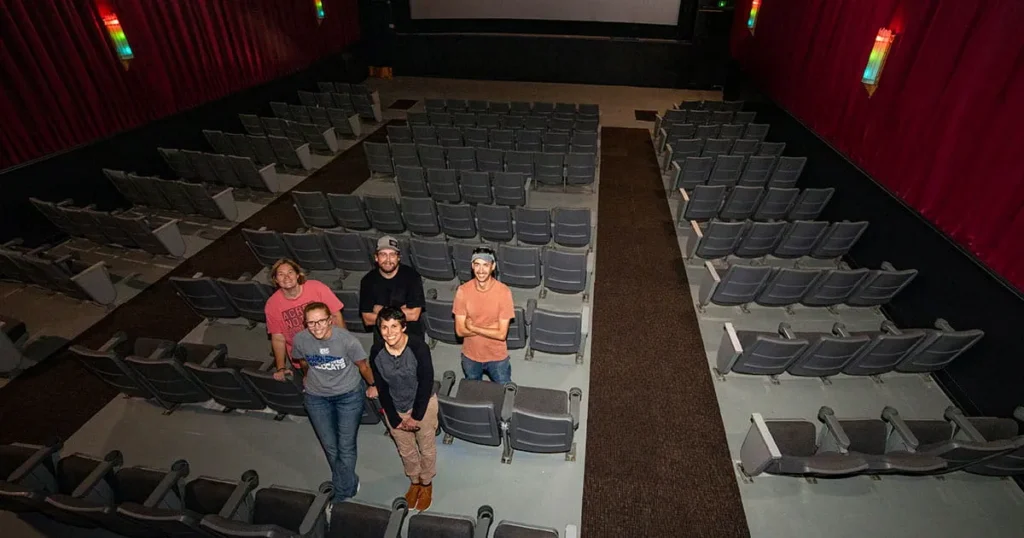 People standing in a movie theater