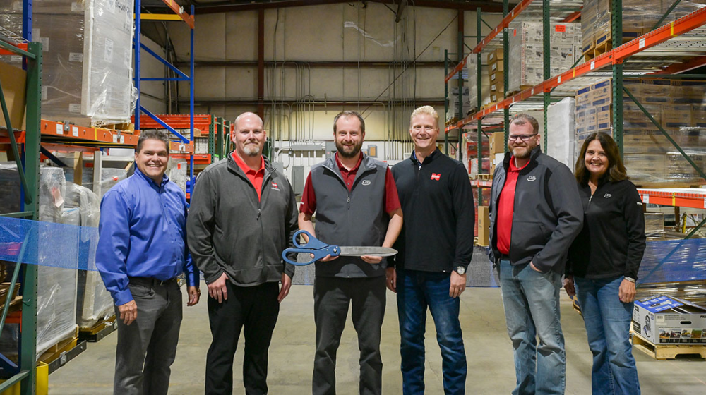 people in a warehouse with a scissors