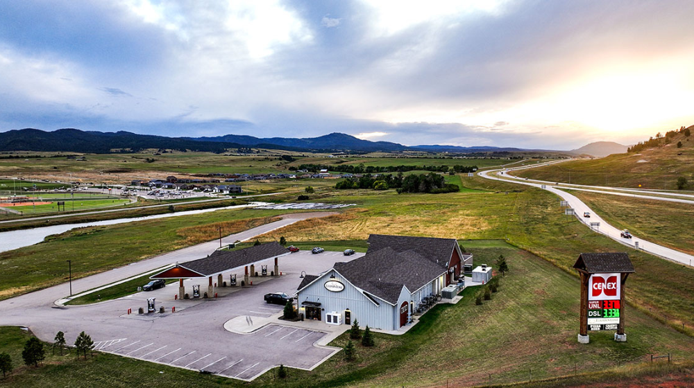 Aerial photo of travel plaza next to a highway