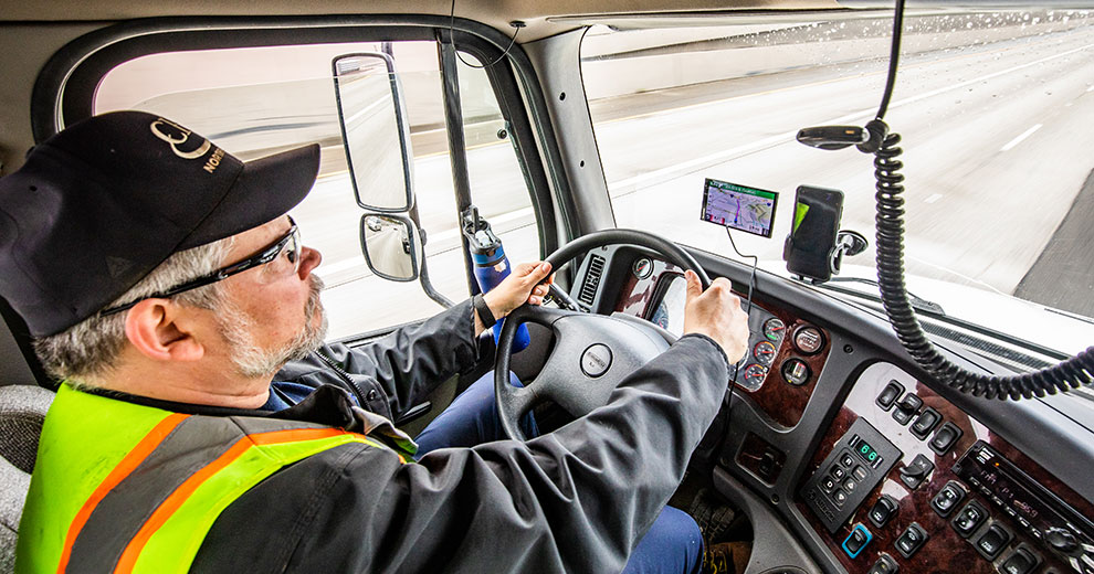 A man driving a truck.