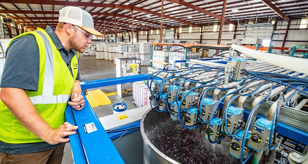 Man watching seed mixing